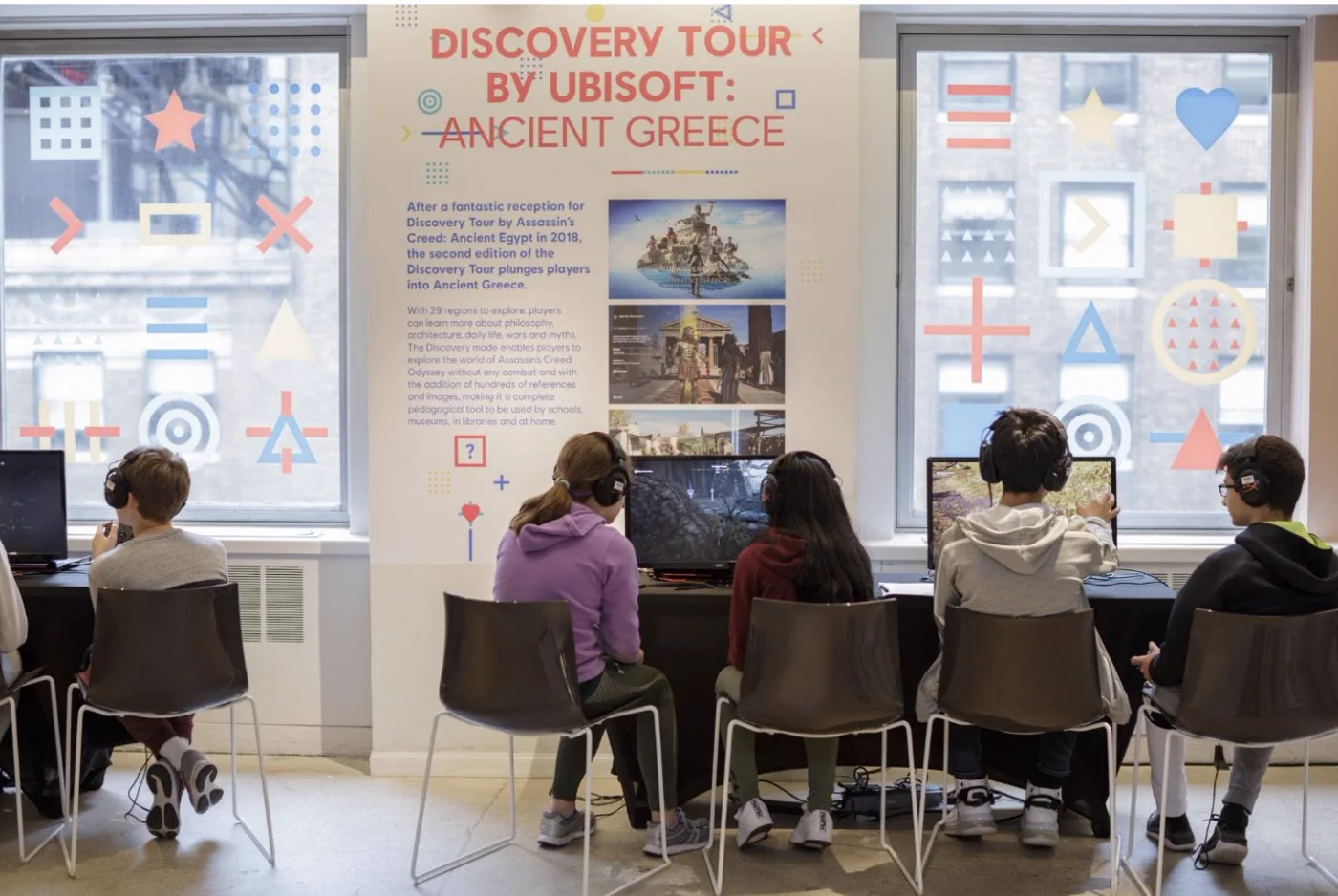 Visitors exploring a digital game exhibit together.