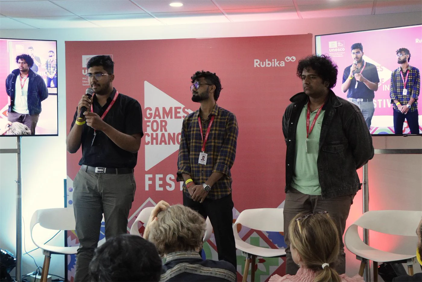 A speaker sharing ideas about the role of games in society.